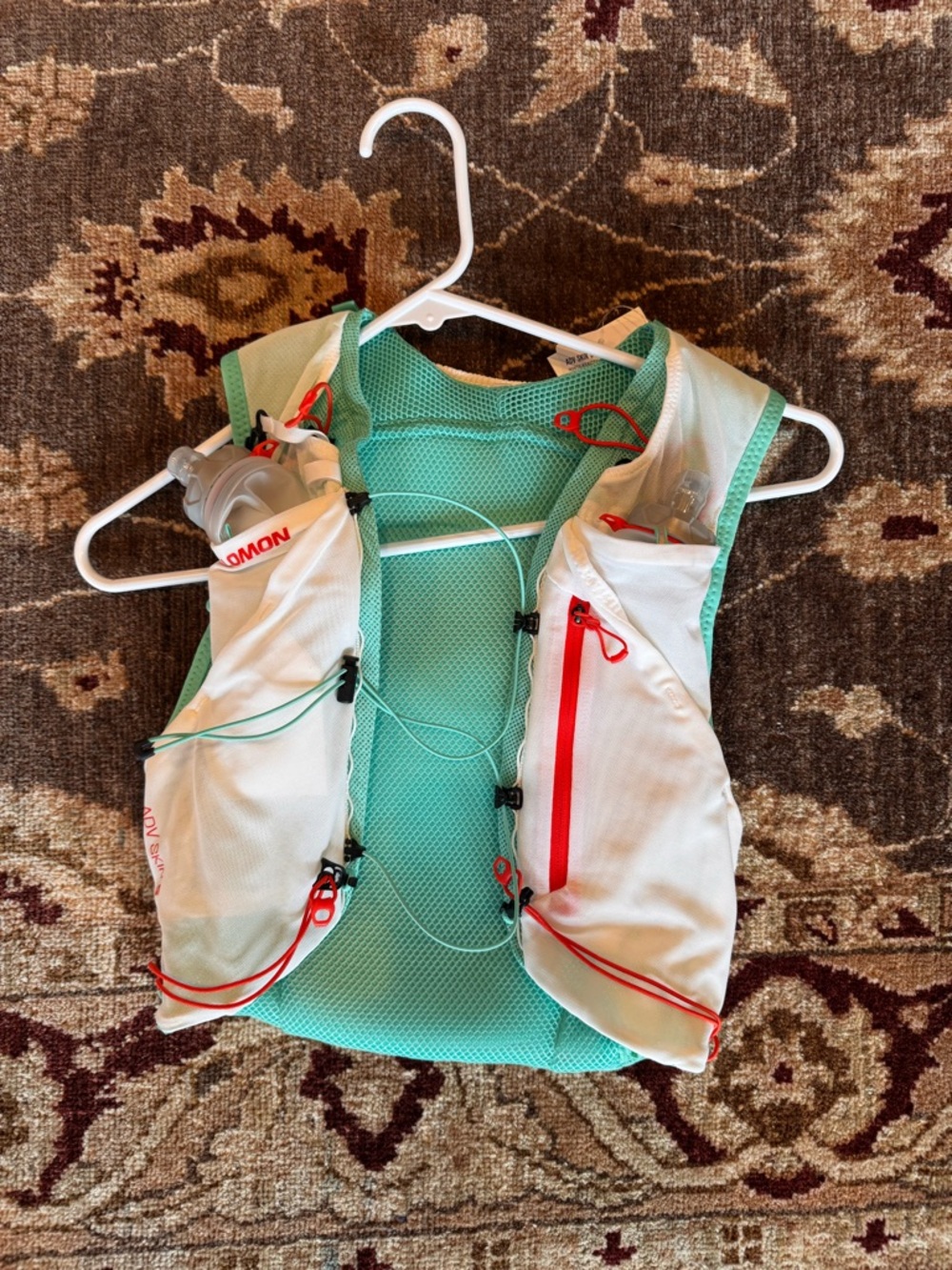 Salomon Women's White and Teal Hydration Vest with Red Accents